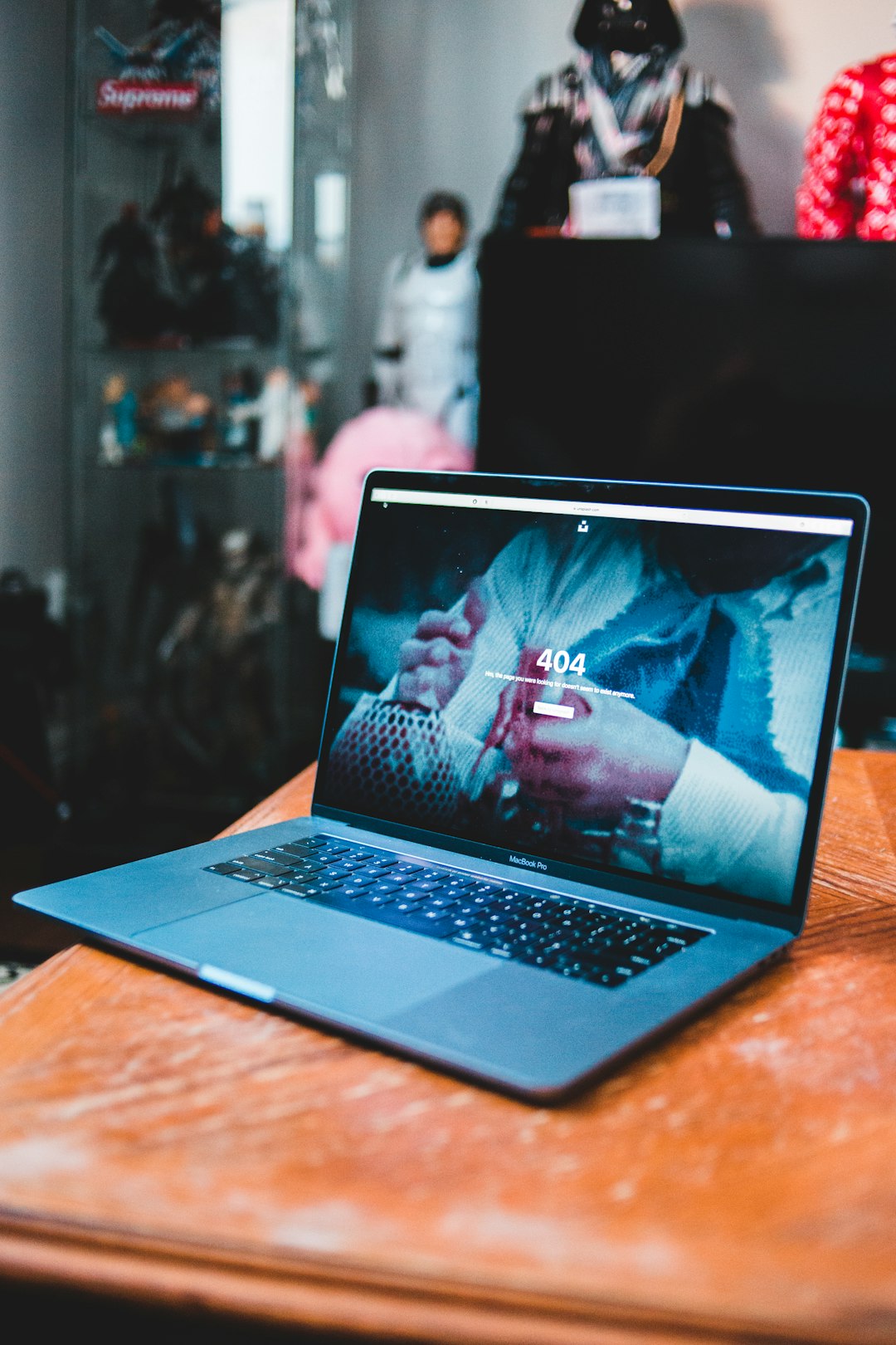 black-laptop-computer-on-brown-wooden-table-rg-fytq5rgw